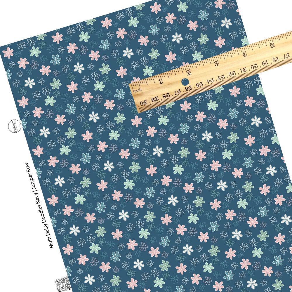 Drawn pastel flowers on navy faux leather sheets