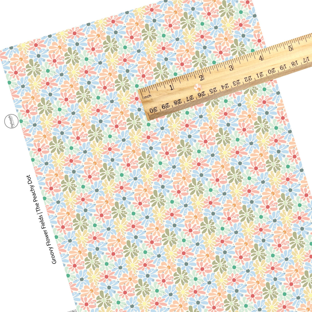 sage, blue, pink, and yellow flowers with polka dots on cream faux leather sheets