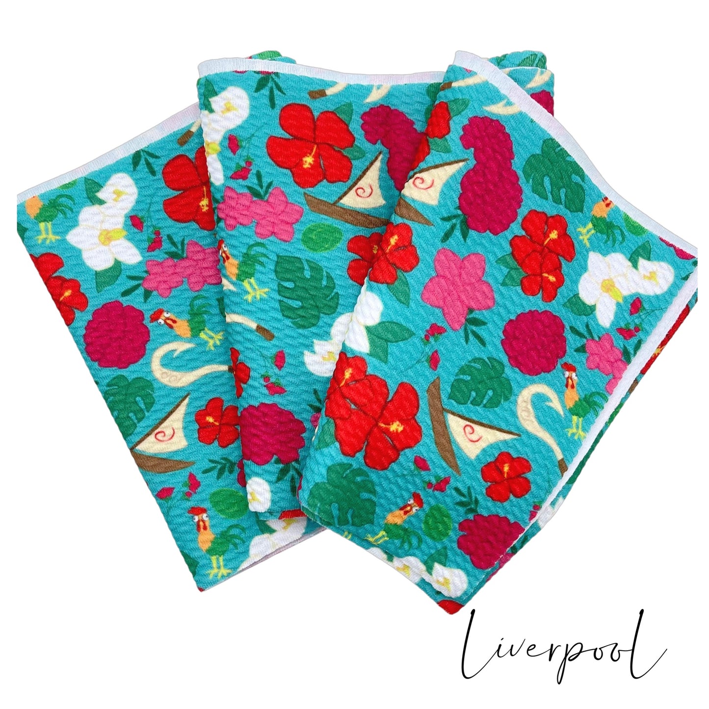 Folded aqua Liverpool stretch fabric strip with pink, fuchsia, red and white floral princess pattern including sail boat, hook, and chickens.