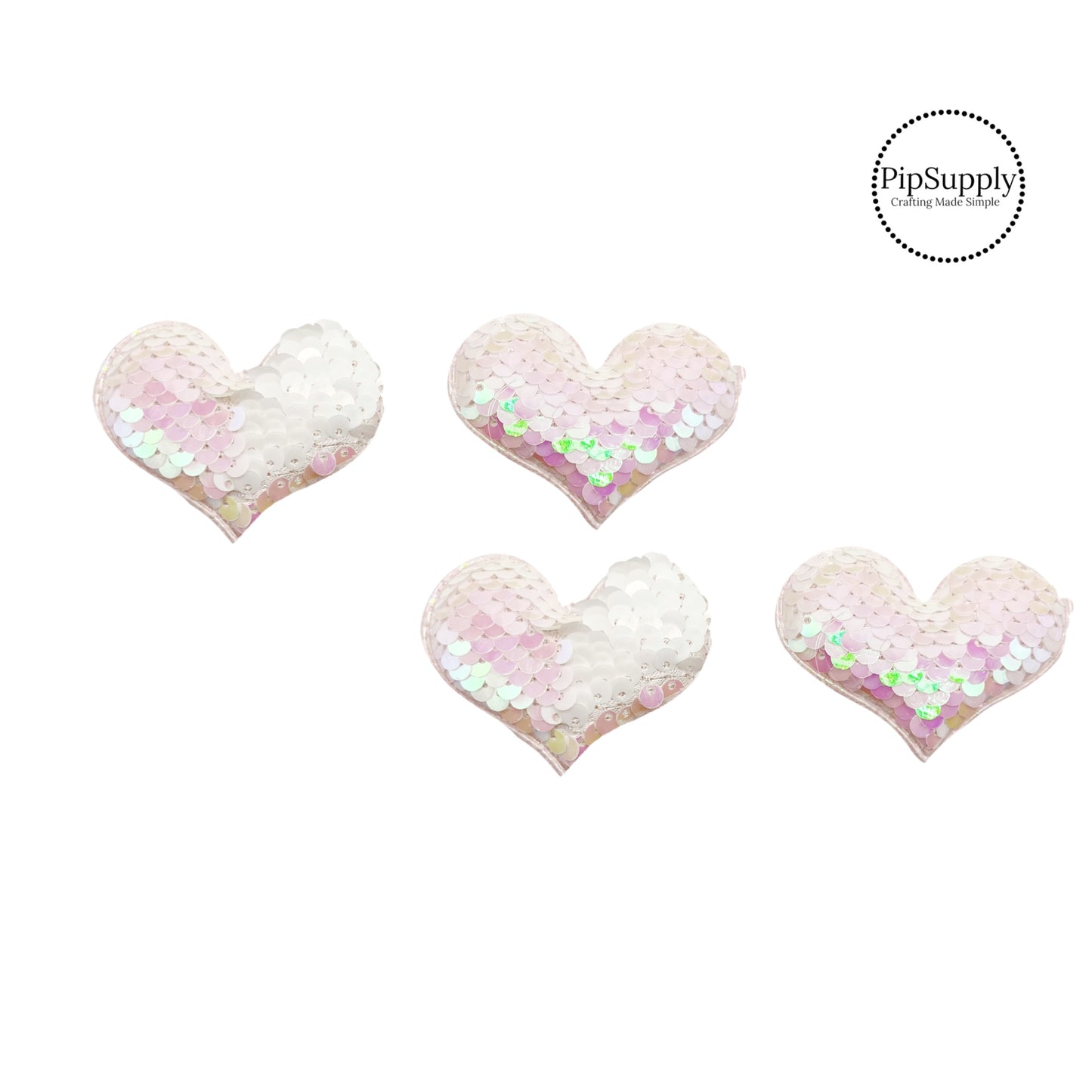 two and a half inch wide iridescent and white reversible sequin heart embellisment