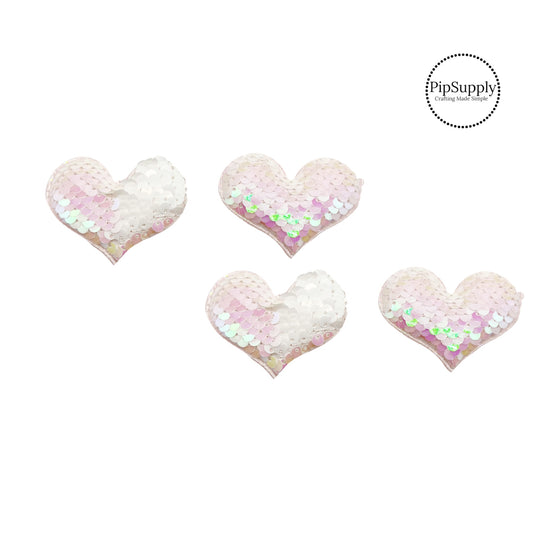 two and a half inch wide iridescent and white reversible sequin heart embellisment