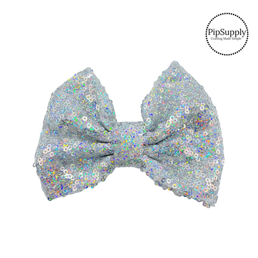 Iridescent sequins on silver bow