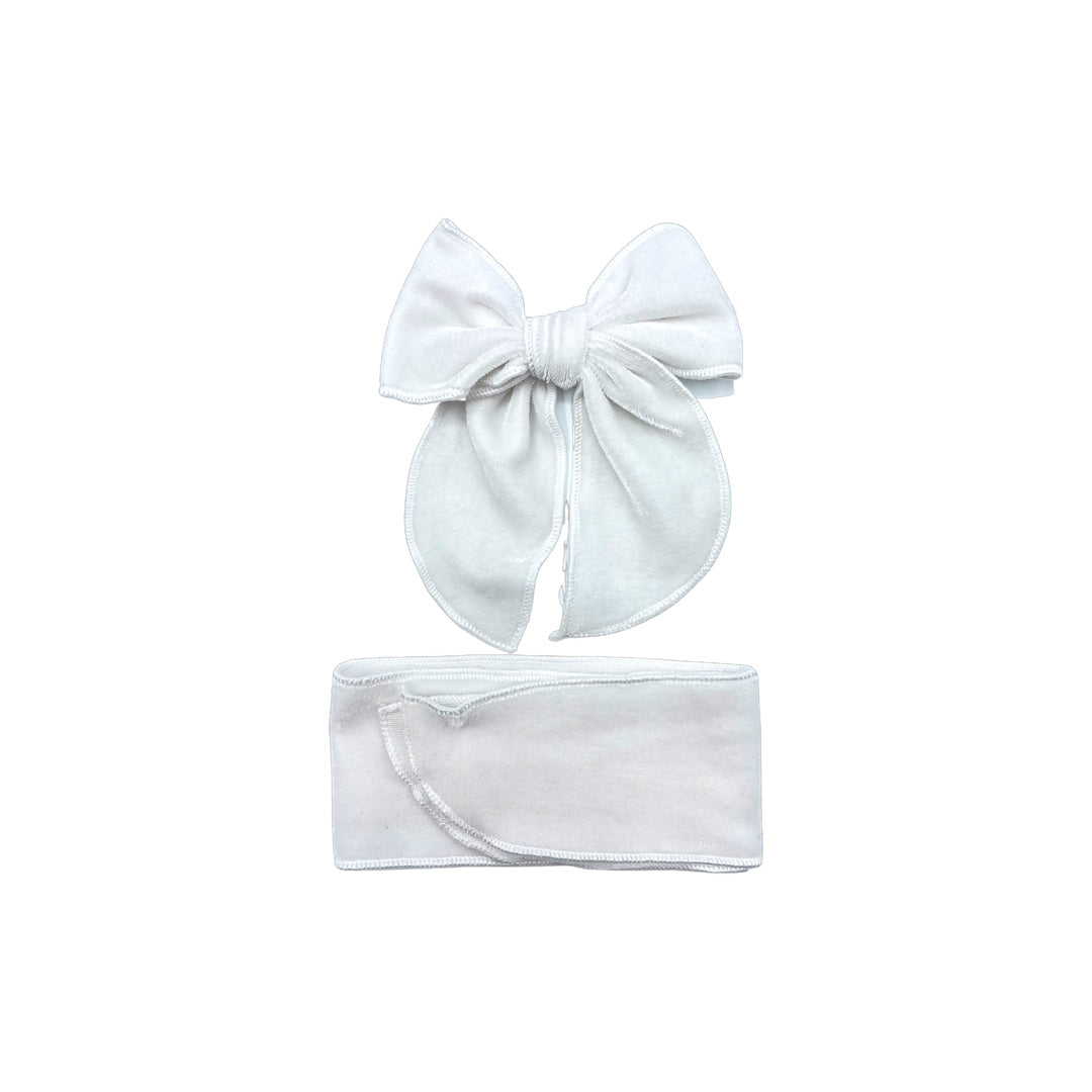 White tied and untied isabelle style velvet bow strip.