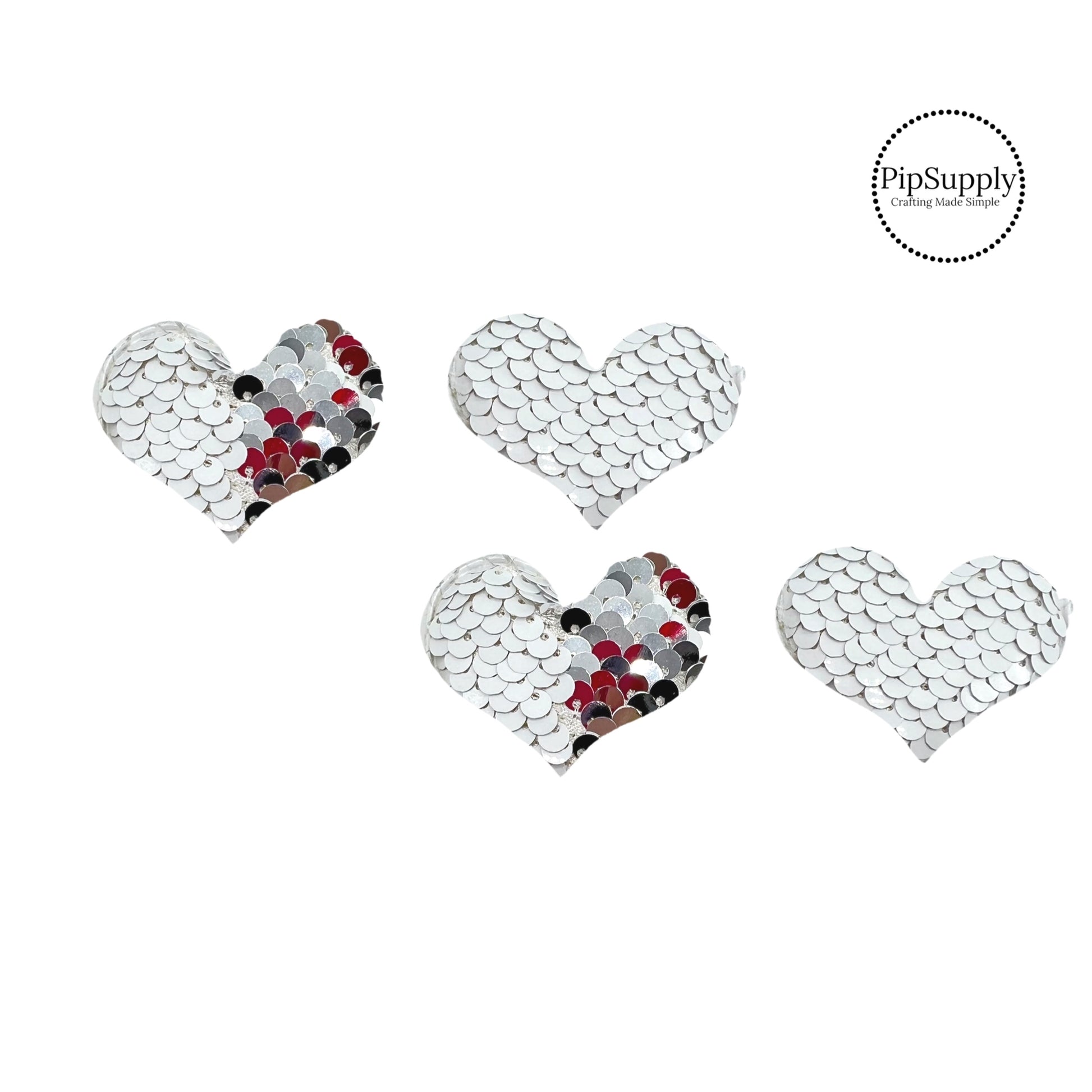 two and a half inch wide matte white and silver reversible sequin heart embellisment
