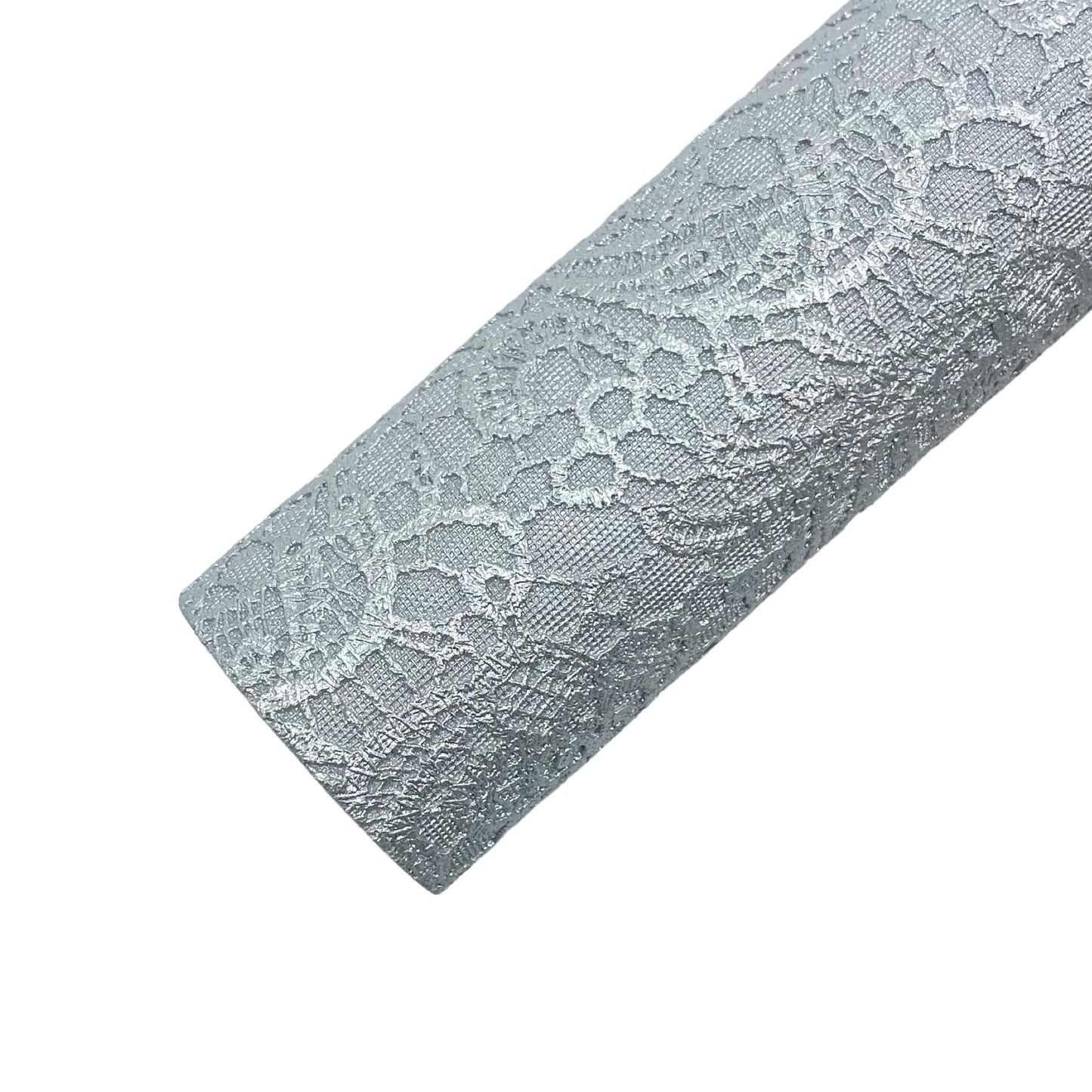 Rolled silver metallic embossed lace faux leather sheet.
