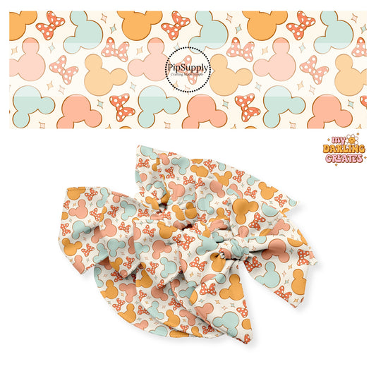 Orange, peach, and blue mouse heads with red polka dot hair bow with stars on cream bow strips