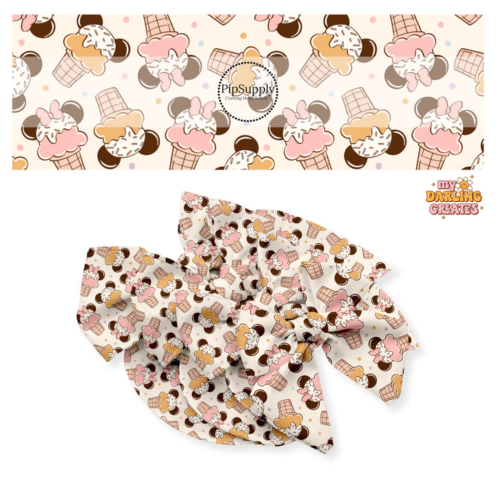 Vanilla ice cream cone with mouse ears, pink bow, and pink ice cream and vanilla ice cream cone with mouse ears and yellow ice cream and sprinkles on cream bow strips