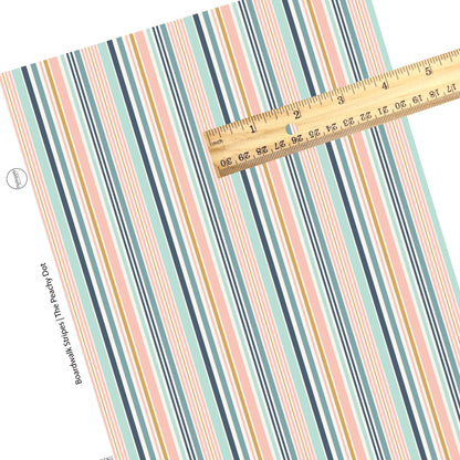 Vertical pink, navy, gold, cream, and aqua stripes faux leather sheet