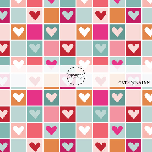 Multi-colored pink, orange, and blue checkered print with hearts fabric by the yard