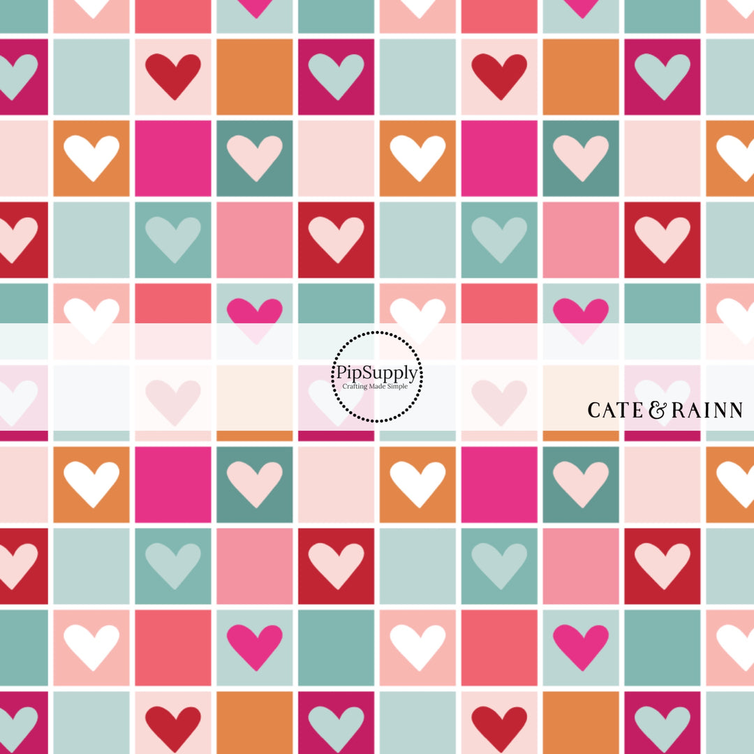Multi-colored pink, orange, and blue checkered print with hearts fabric by the yard