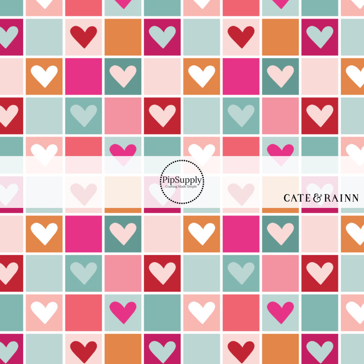 Multi-colored pink, orange, and blue checkered print with hearts fabric by the yard