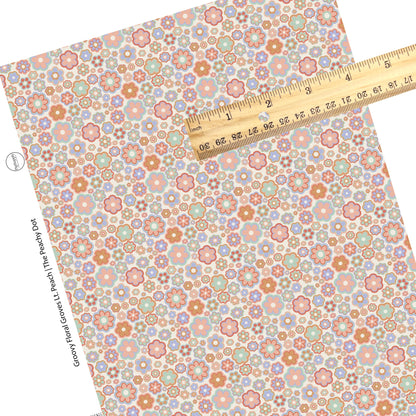 orange, lavender, and pink layered multi flowers on light peach faux leather sheets