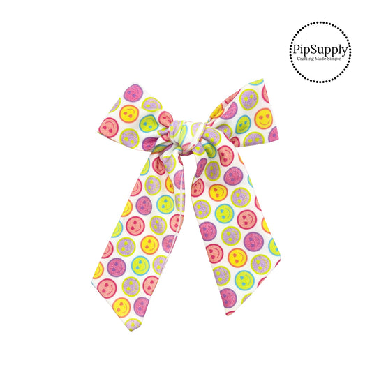 pink, purple, orange, yellow, and lime leopard smiley faces on swim bow strip