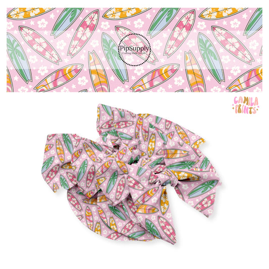 Floral, groovy, and palm trees on multi surfboards on floral pink bow strips