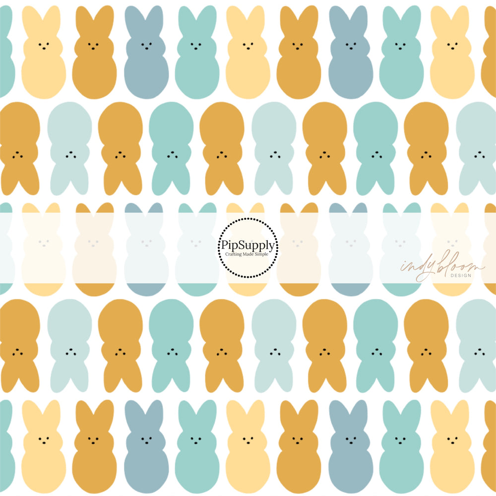 Blue, yellow, and brown bunnies on white bow strips