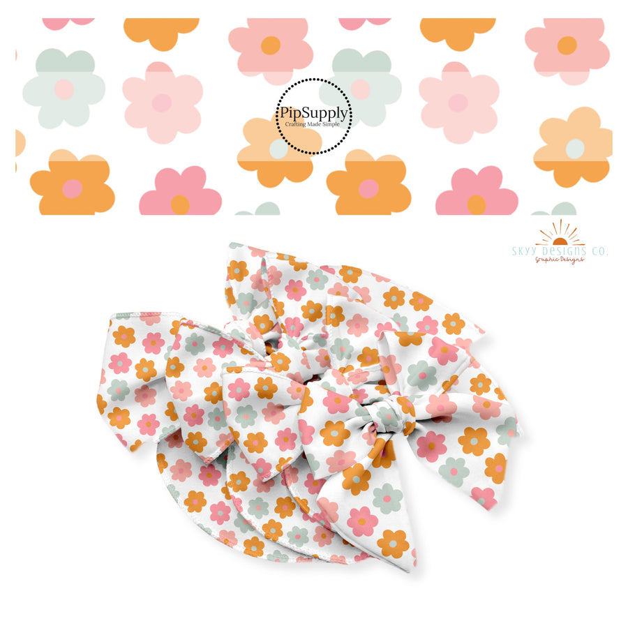 Orange, pink, and blue flowers on white bow strips