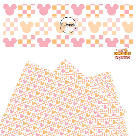 Light pink and orange mouse head with matching checkerboard patches on white faux leather sheets