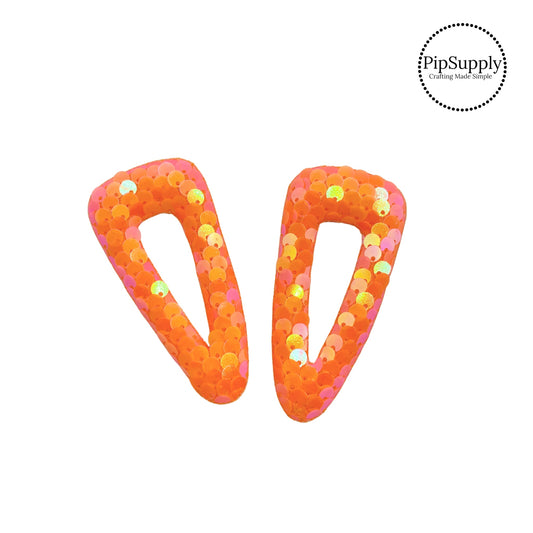 Iridescent orange sequins on padded clip covers