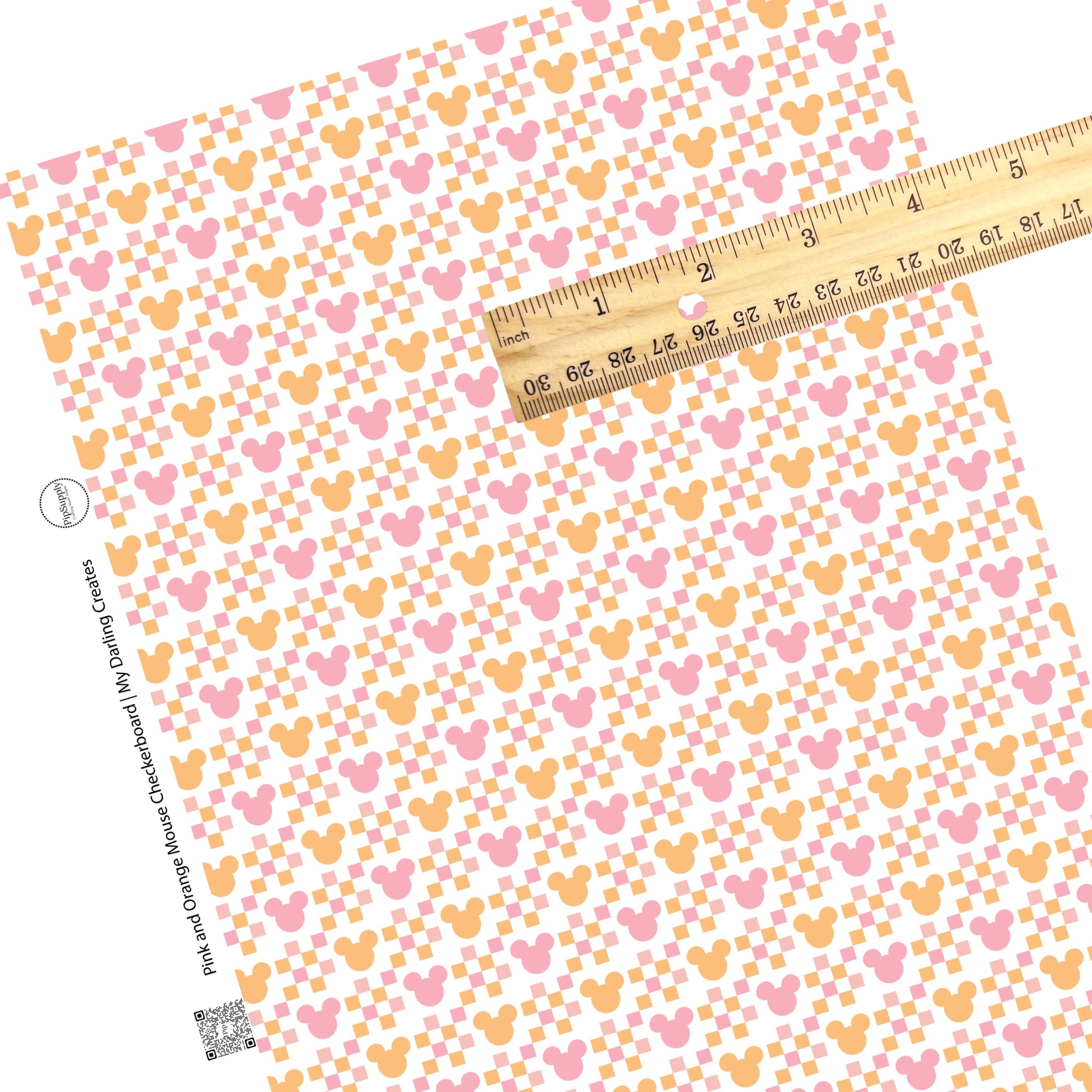 Pink and orange checkerboard patches with pink and orange mouse heads on white faux leather sheet