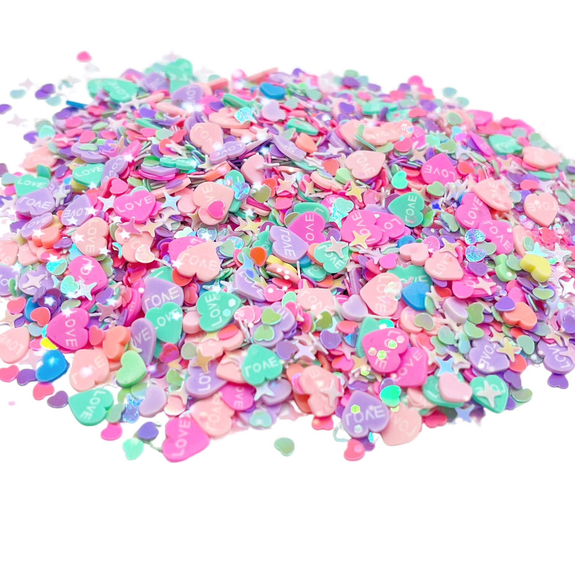 Pastel heart polymer clay slice mix and sequin mix with sequin hearts and sparkles.