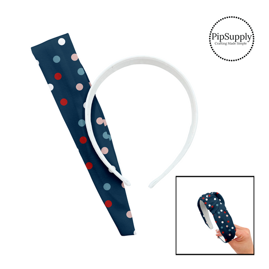 Pink, blue, red, and white scattered polka dots on navy knotted headband