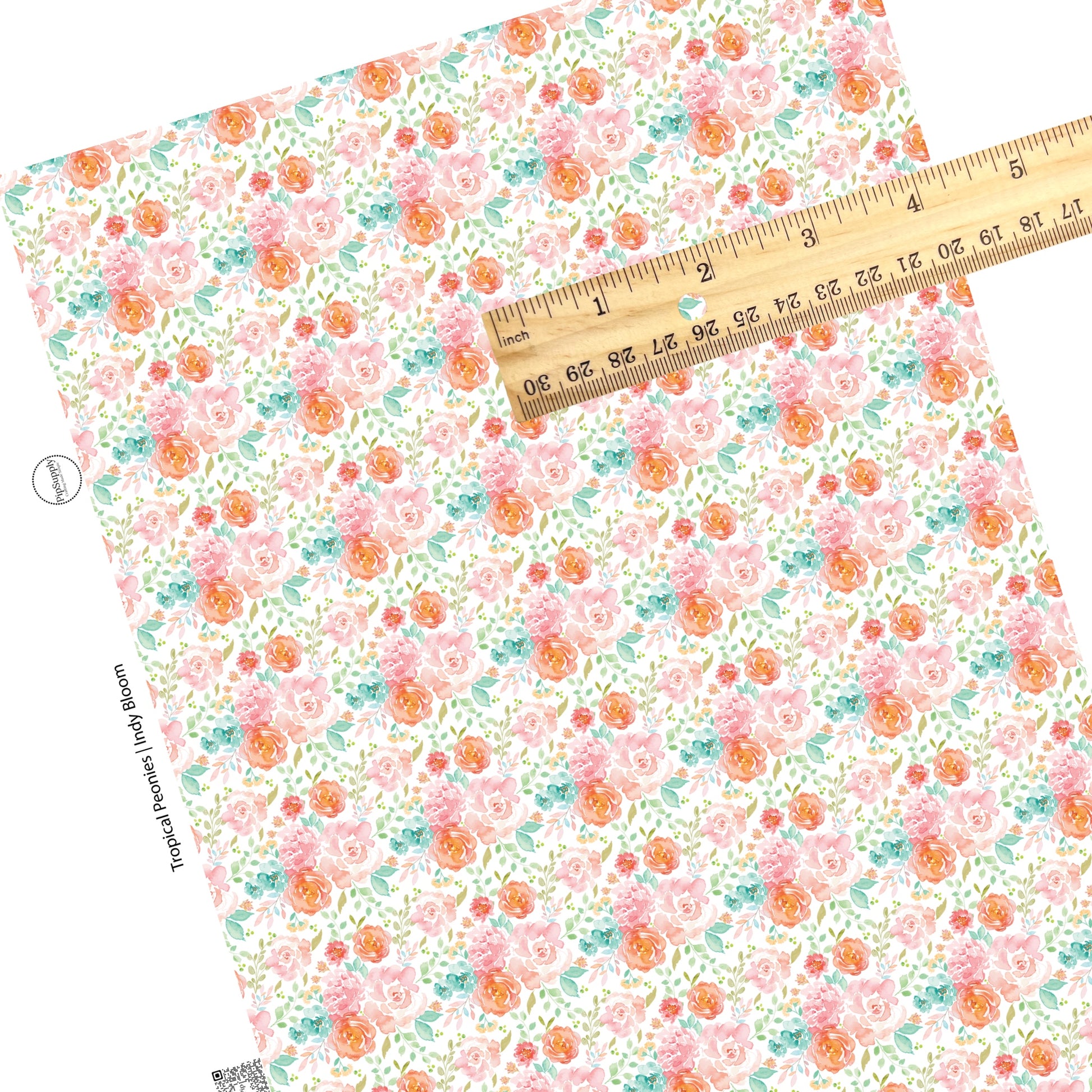 Patches of blue, peach, and pink flowers on white faux leather sheets