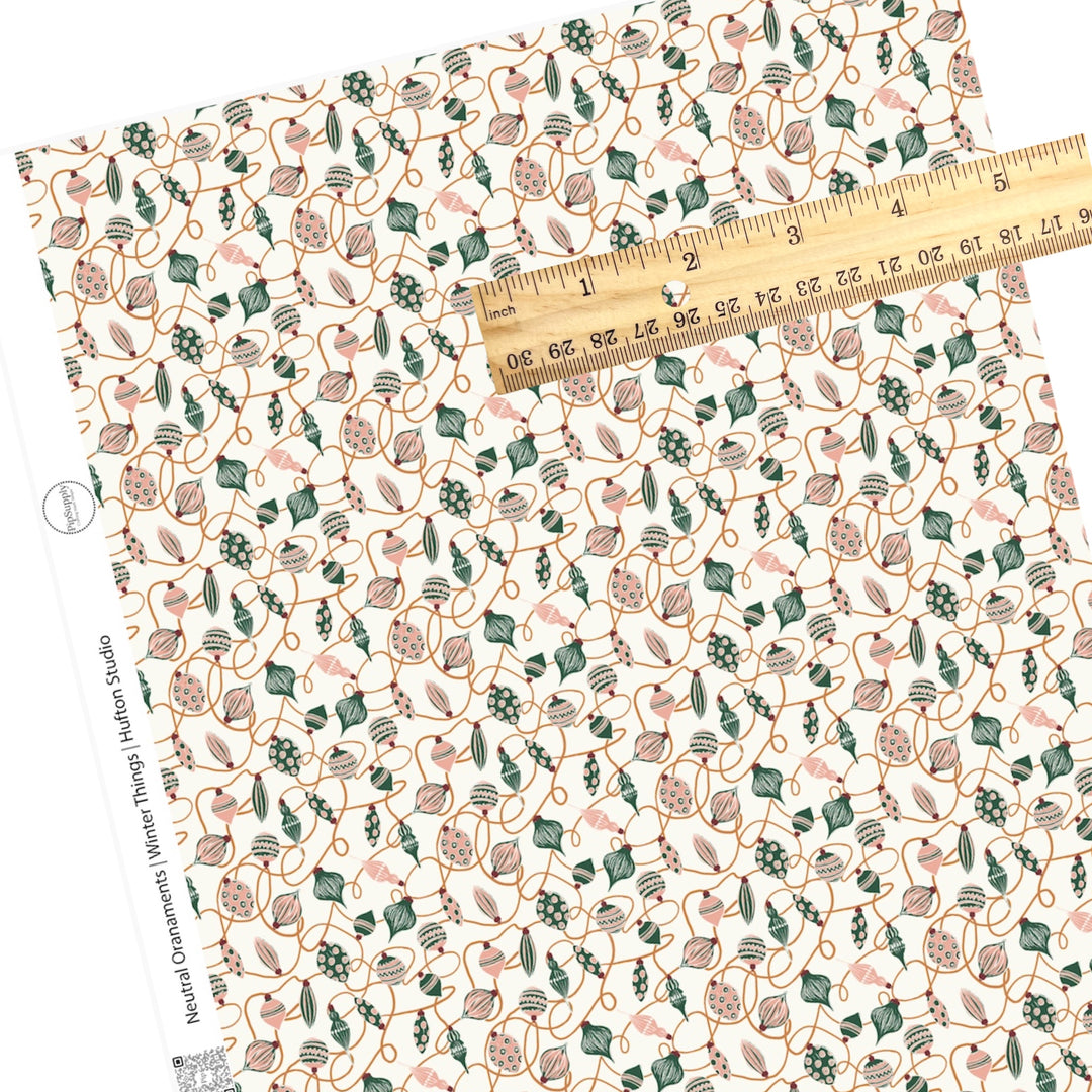 scattered ornaments in pink and green faux leather sheet