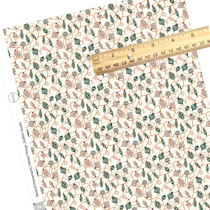 scattered ornaments in pink and green faux leather sheet