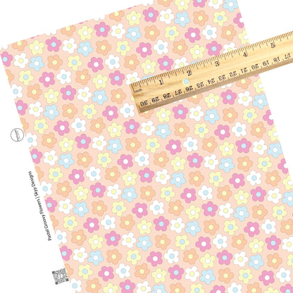 Scattered multi flowers on peach faux leather sheets