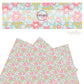 Pink, white, orange, and light pink flowers on aqua faux leather sheets