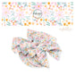 pink, orange, and blue flowers on pearl bow strips