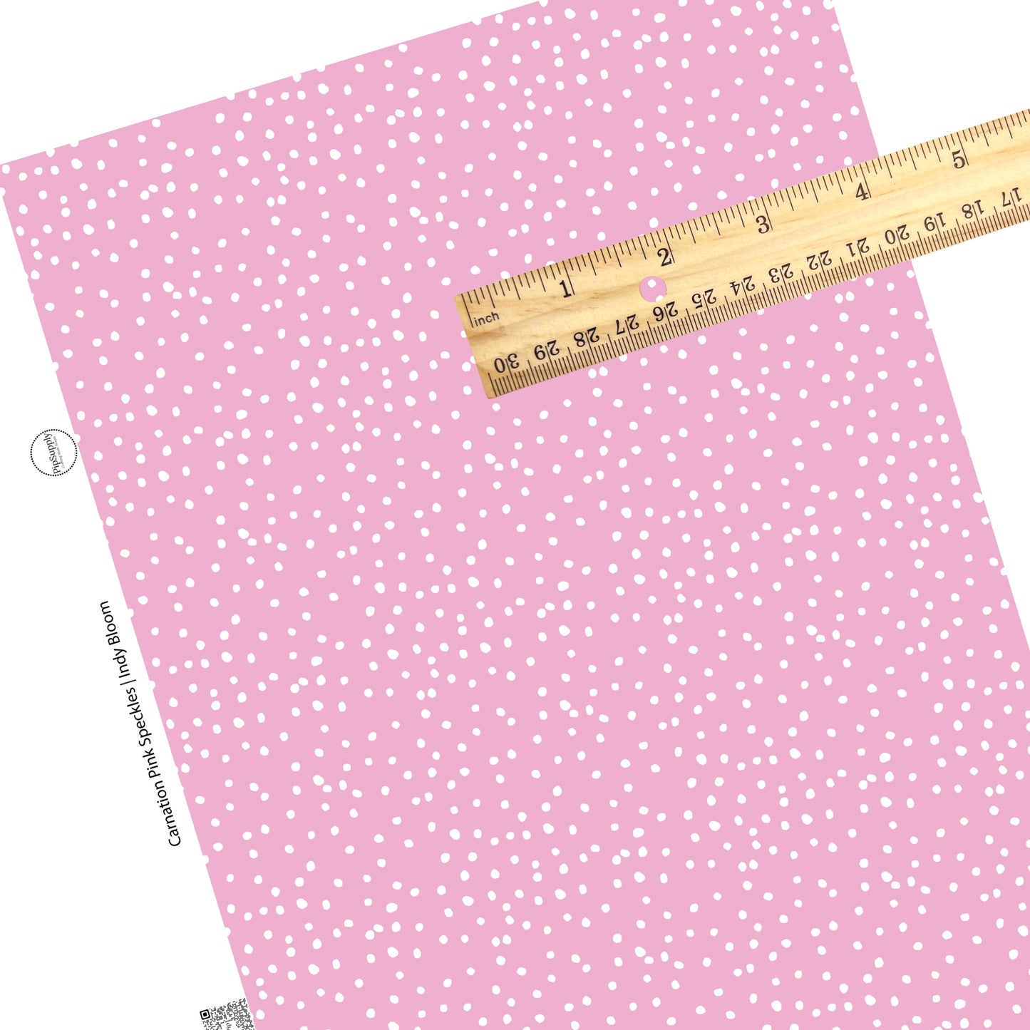 White polka dots on pink faux leather sheets