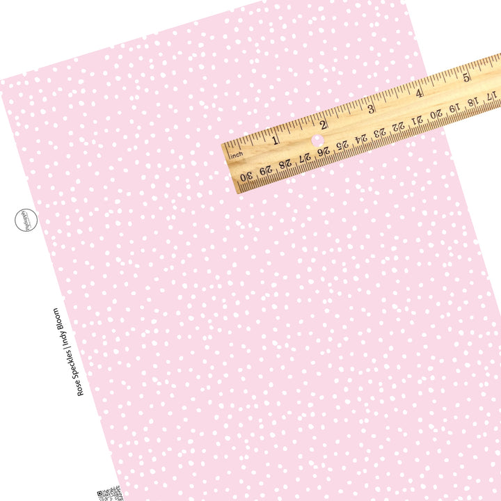 Tiny white dots on pink faux leather sheets