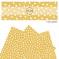 White polka dots on yellow faux leather sheets