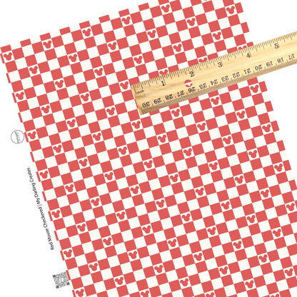 Red mouse head and tiles on cream checker faux leather sheets