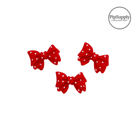 Red bow with white polka dot resin embellishment