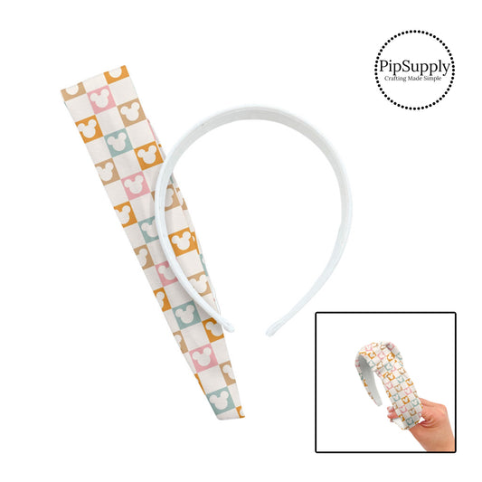 Light pink, orange, blue, and tan tiles with cream mouse cutouts checkered knotted headband