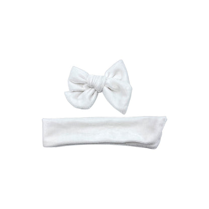 White tied and untied Ruth style velvet bow strip.