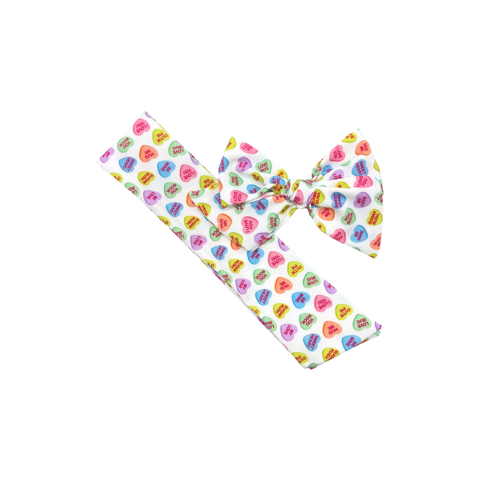 Tied and untied white Ruth style fabric bow strip with conversation heart pattern.
