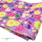 Light Purple neoprene fabric with yellow, white, pink, and lavender floral princess pattern including chameleon, pan, and lanterns.