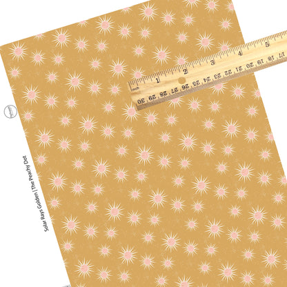 Splatter spots with pink sun rays on gold faux leather sheets