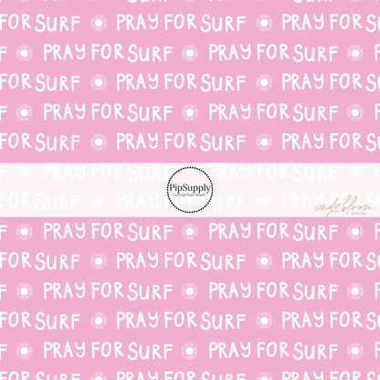 Surf sayings "pray for surf" written in white on pink bow strips
