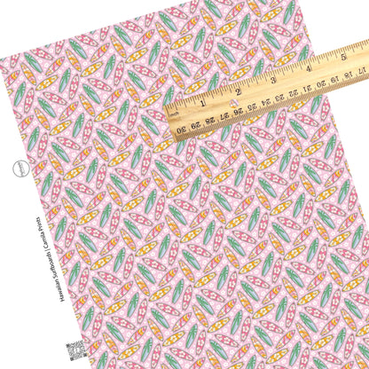 Floral, groovy, and palm trees on multi surfboards on floral pink faux leather sheets