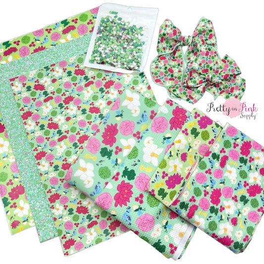 The bayou princess collection of fabrics, faux leather, glitter clay mix, hair bows, and glitter sheet, and heat transfer vinyl.