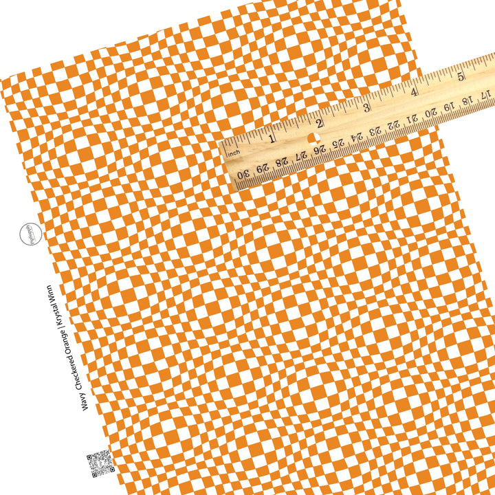 Orange tiles on white checkered faux leather sheets