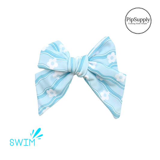 White flowers on wavy cyan swimsuit bow strip