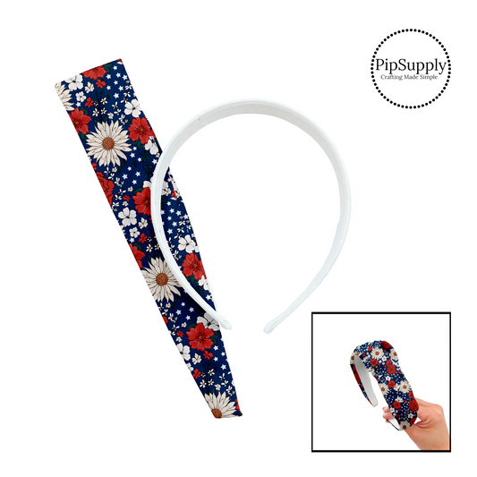 Red and white flowers with stars on navy blue knotted headband