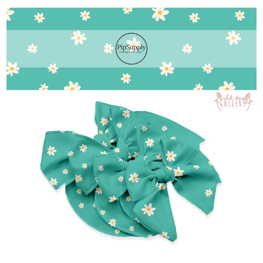 cream flowers with orange center on aqua bow strips