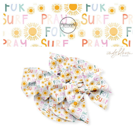 Pray for surf written in multi colors with orange sunshines on white bow strips